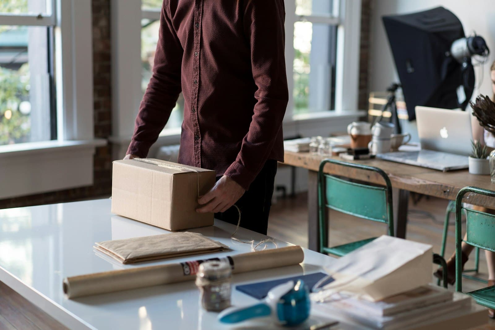 Person packing an e-commerce shipment