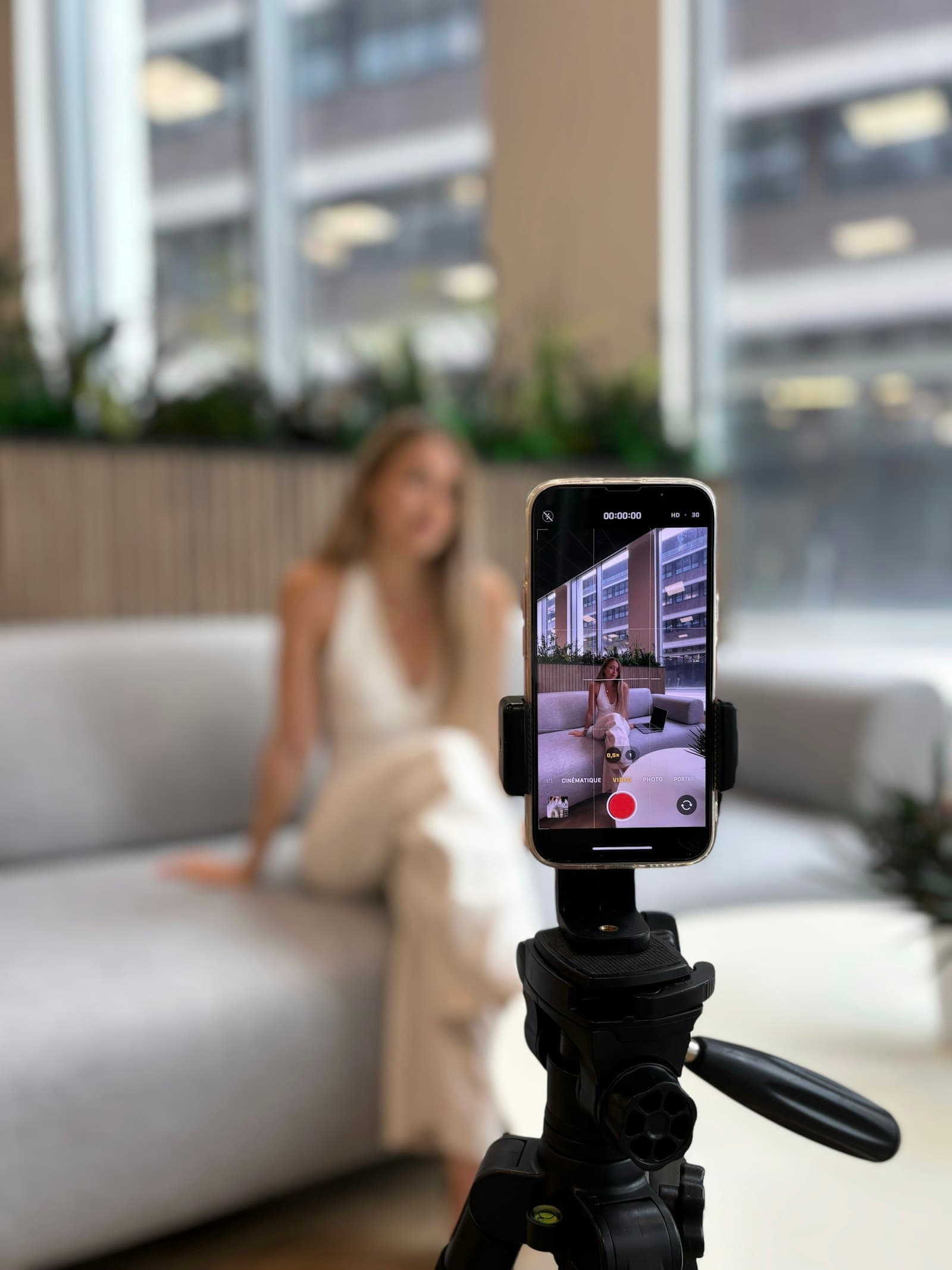 Creator filming a UGC video with a smartphone